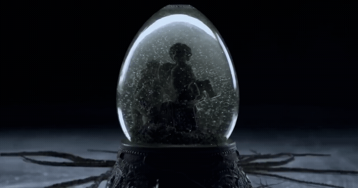 a snow globe sitting on top of a wooden table