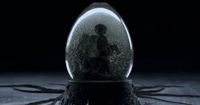 a snow globe sitting on top of a wooden table