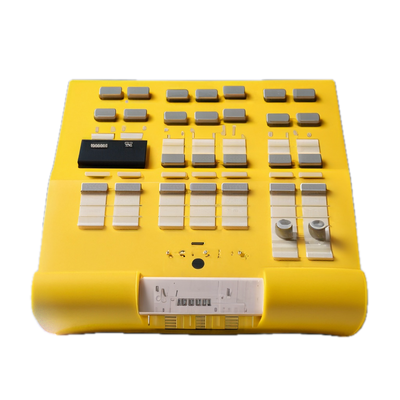 a yellow electronic device with buttons and buttons