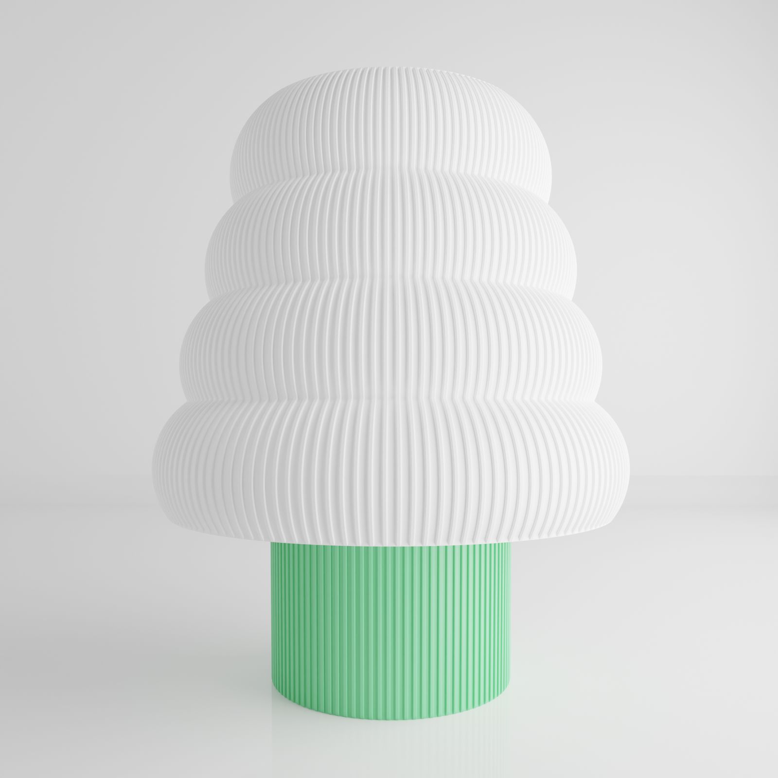 a white and green vase sitting on top of a table