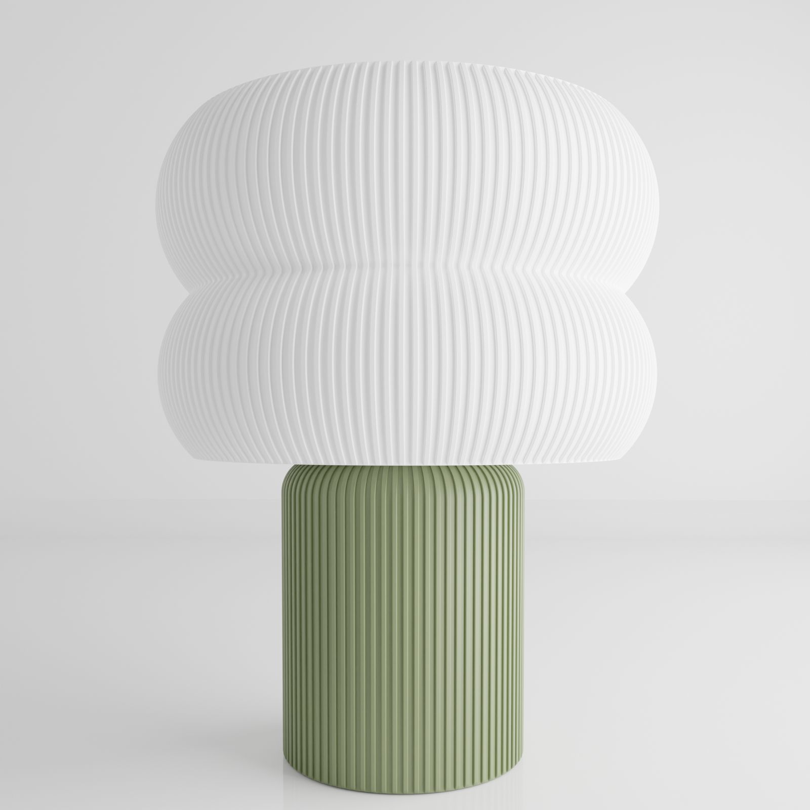 a green and white vase sitting on top of a table