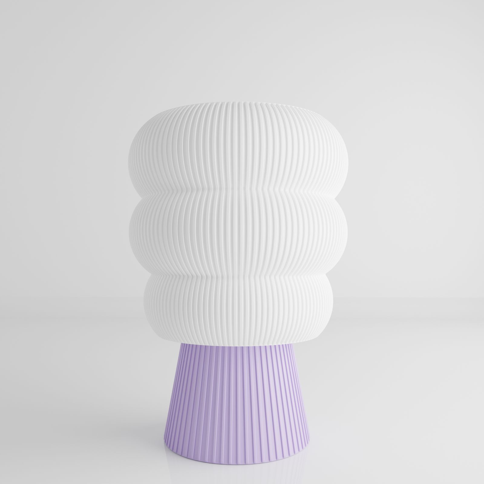 a white and purple vase sitting on top of a table