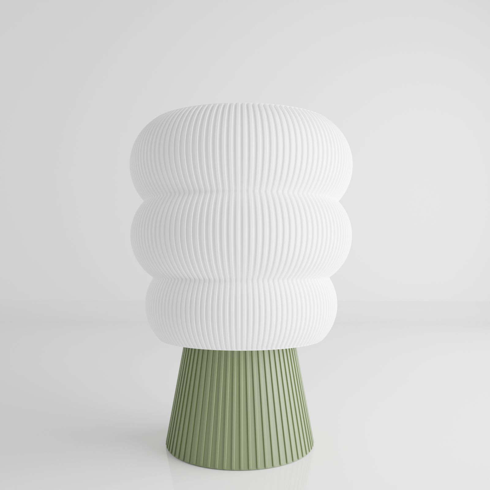 a white and green vase sitting on top of a table
