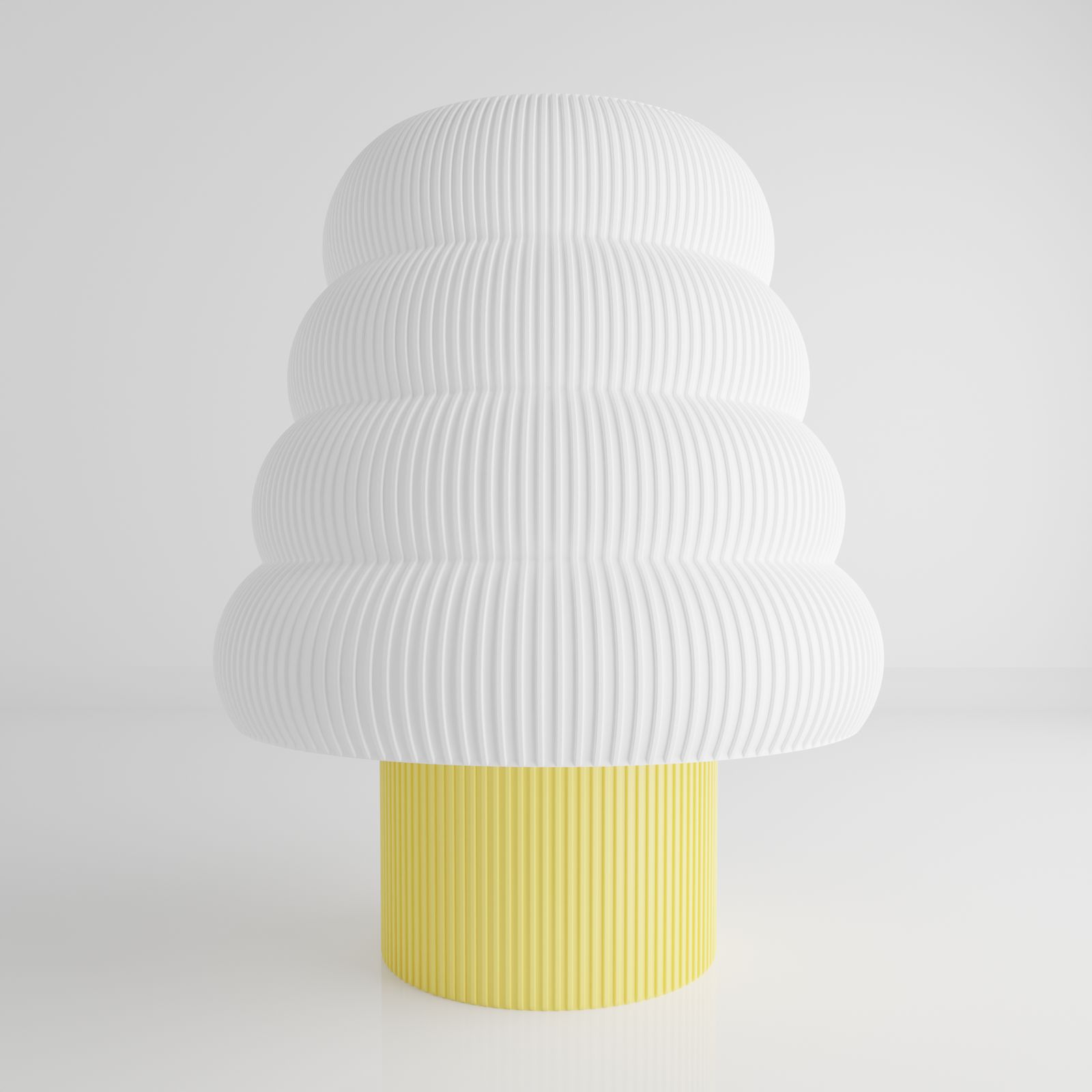 a white and yellow vase sitting on top of a table