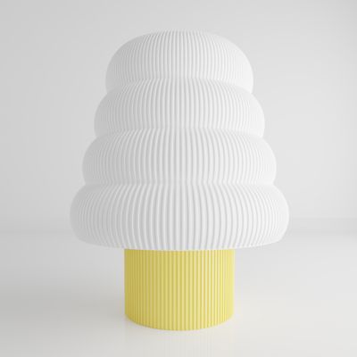 a white and yellow vase sitting on top of a table
