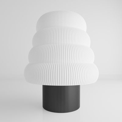 a black and white vase sitting on top of a table