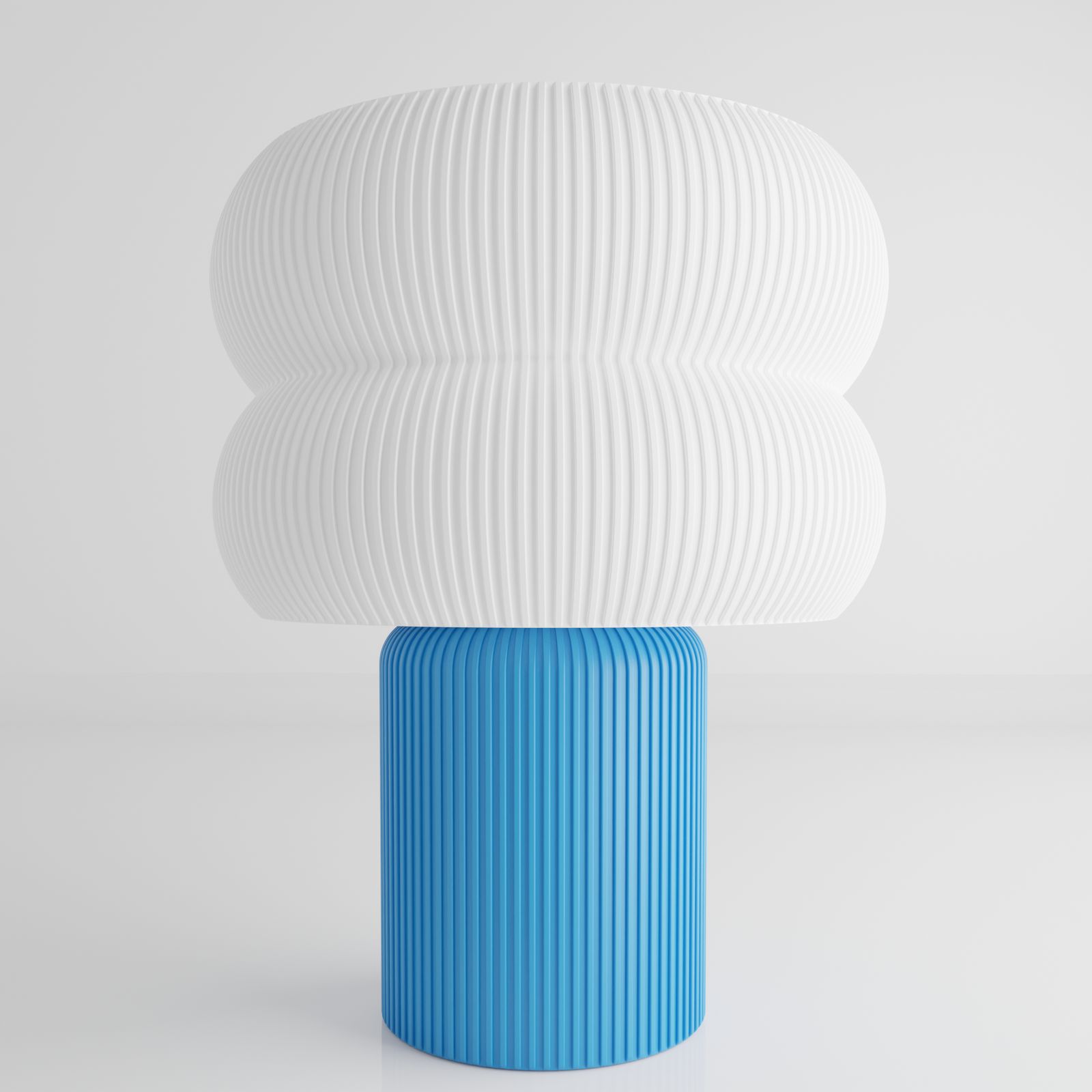 a blue and white vase sitting on top of a table