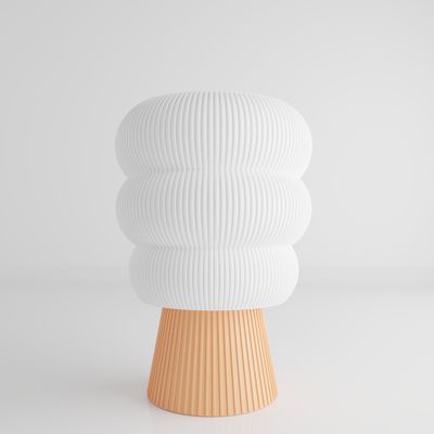 a white vase sitting on top of a wooden stand