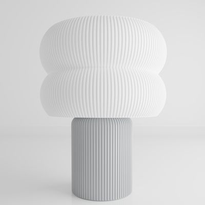 a large white vase sitting on top of a table