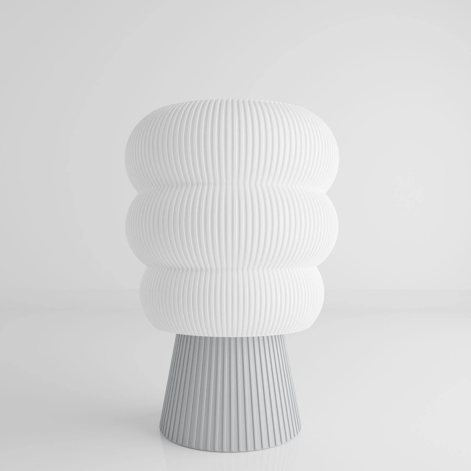 a white vase sitting on top of a table