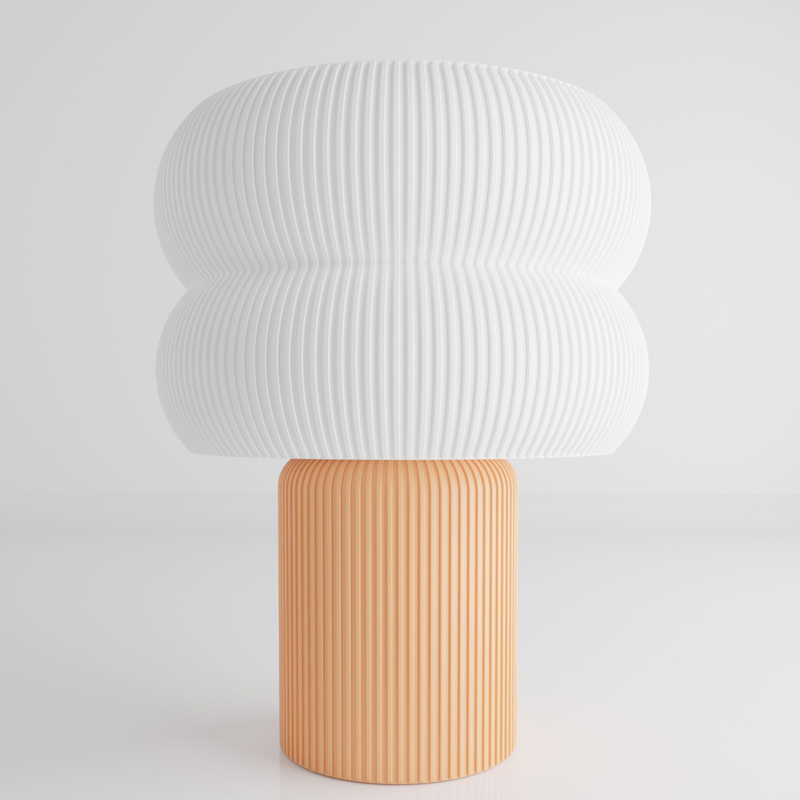 a white and orange vase sitting on top of a table