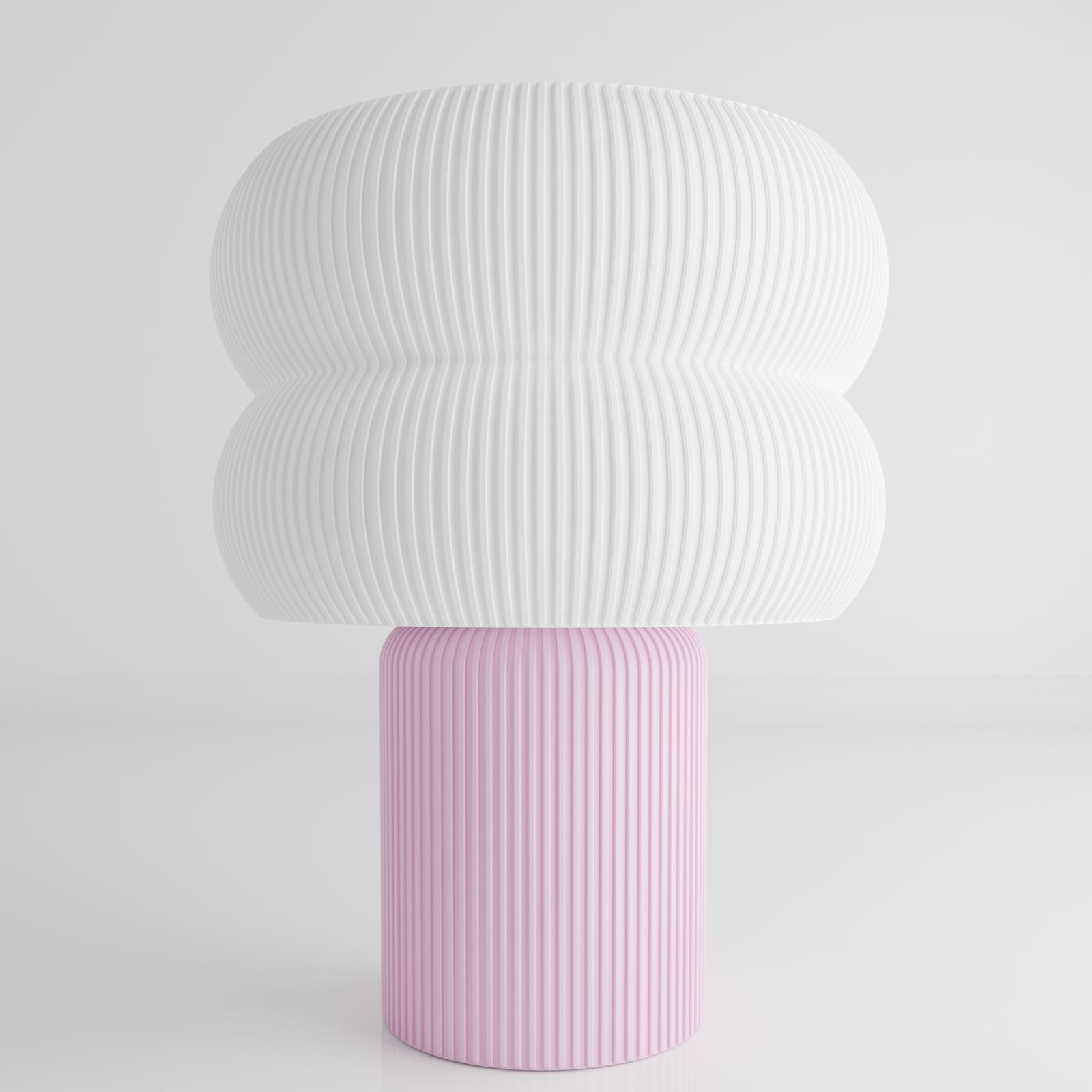 a pink and white vase with a large white object on top of it