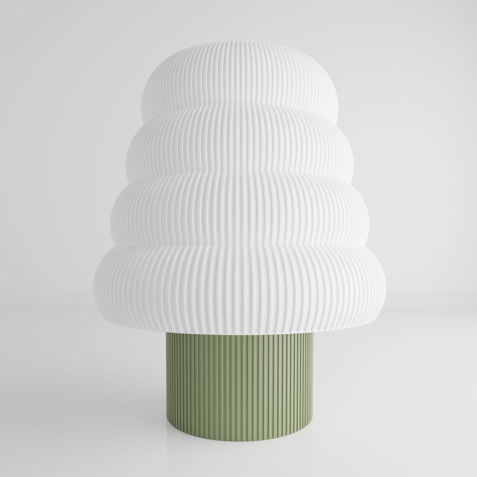 a white and green vase sitting on top of a table