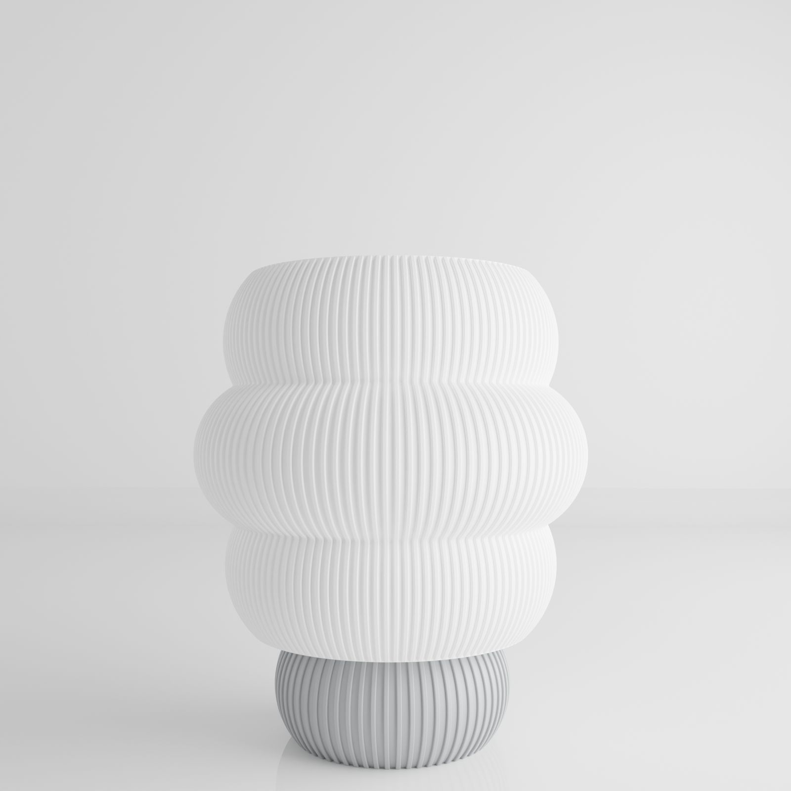 a white vase sitting on top of a table