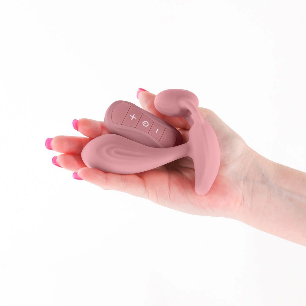 a person holding a pink object in their hand