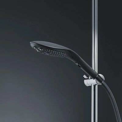 a close up of a shower head with a hand held showerhead