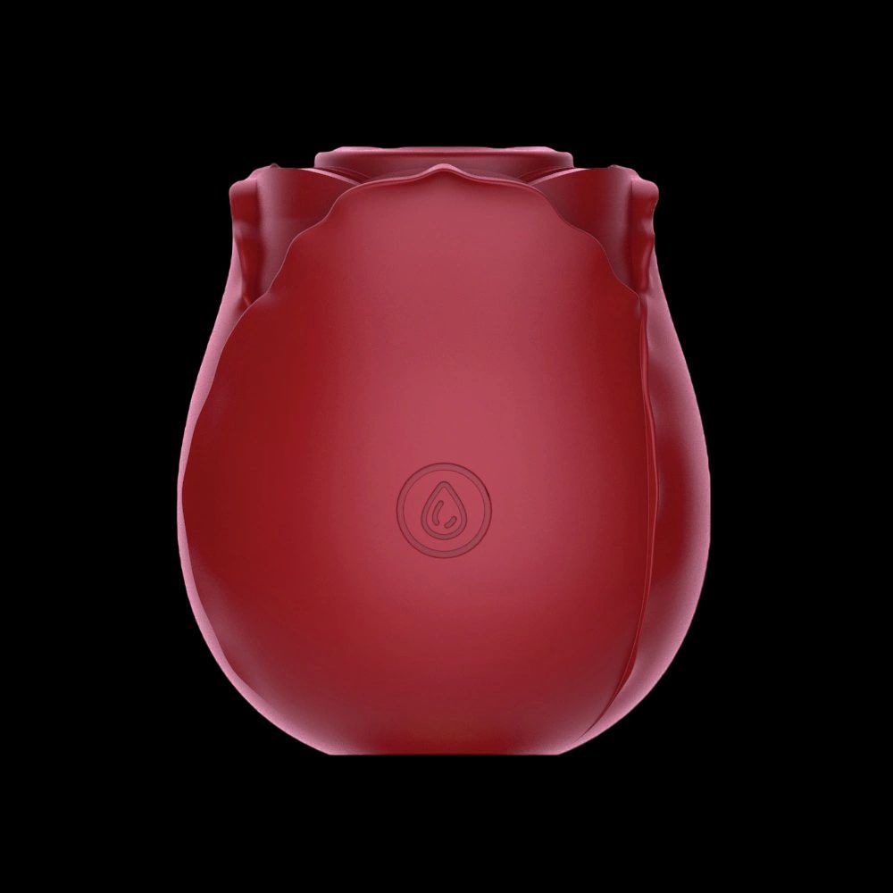 a red vase sitting on top of a black table