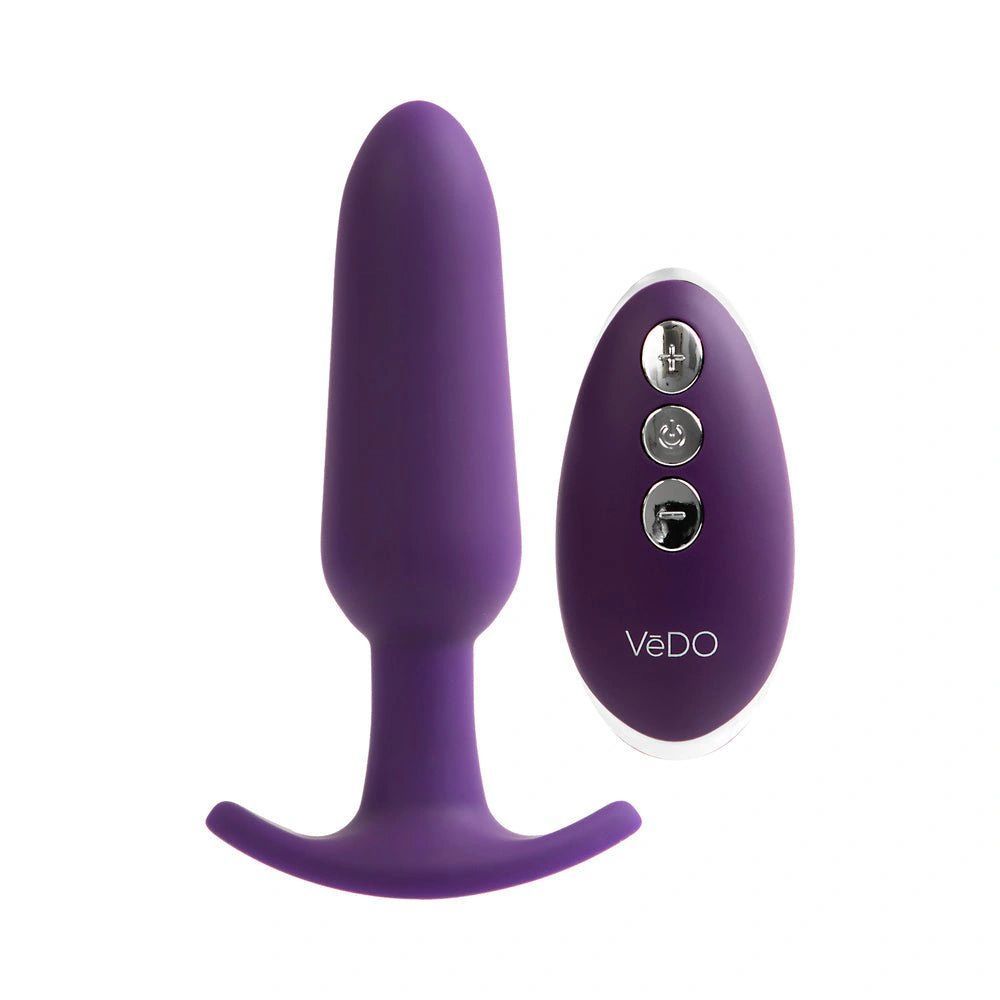 a purple vibrating device sitting next to a white background