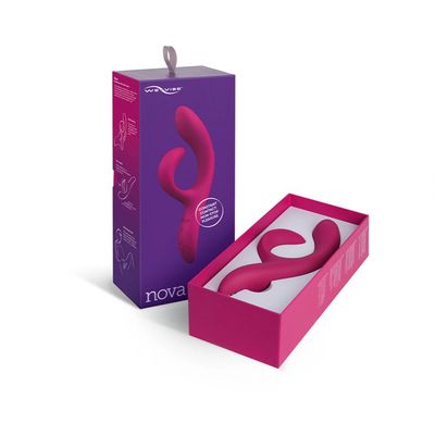 a box with a pair of pink earbuds in it
