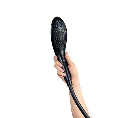 a person holding a hair dryer in their hand