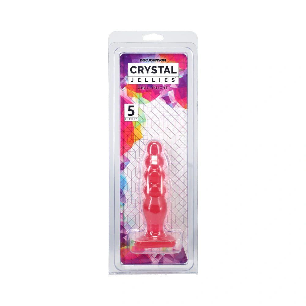a red plastic figure in a plastic package
