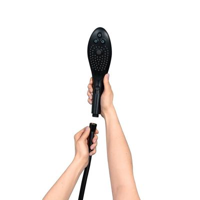 a person holding a hair dryer in their hand