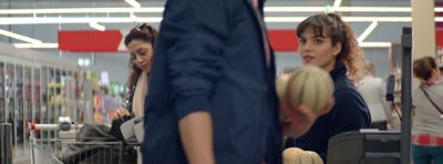 a group of people standing around a store