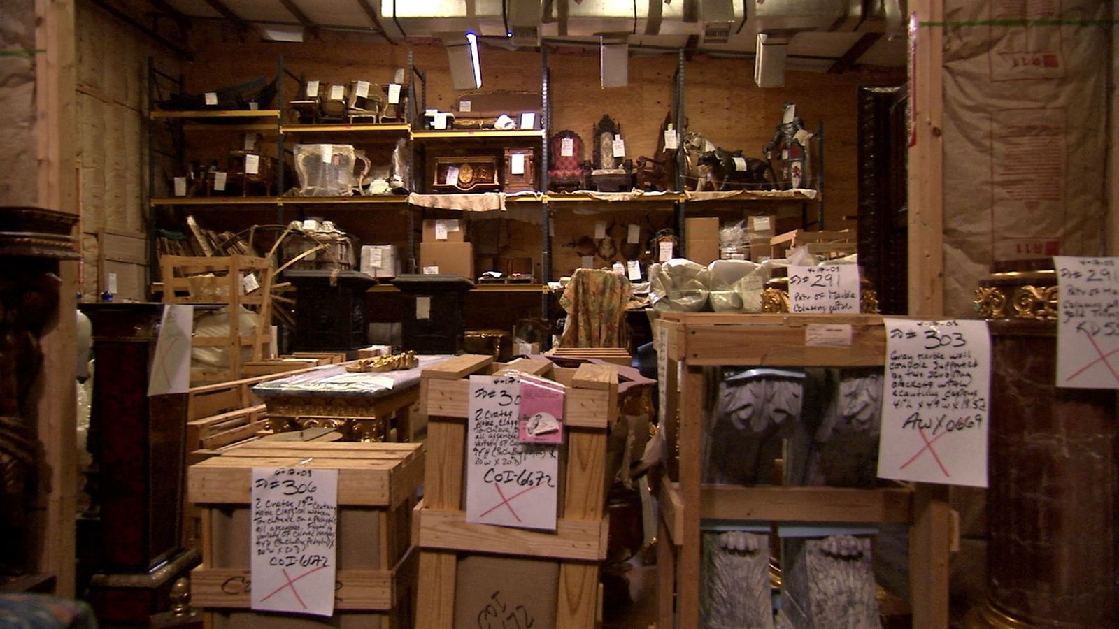 a room filled with lots of wooden boxes