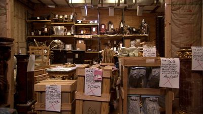 a room filled with lots of wooden boxes