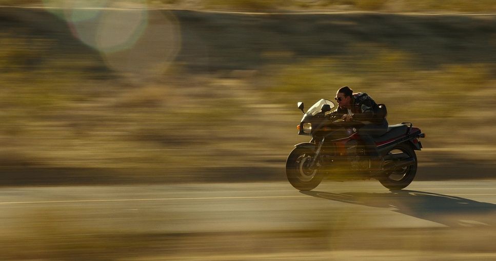 a person riding a motorcycle on a road