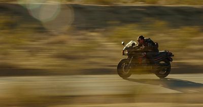 a person riding a motorcycle on a road