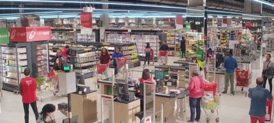 a group of people shopping inside of a store