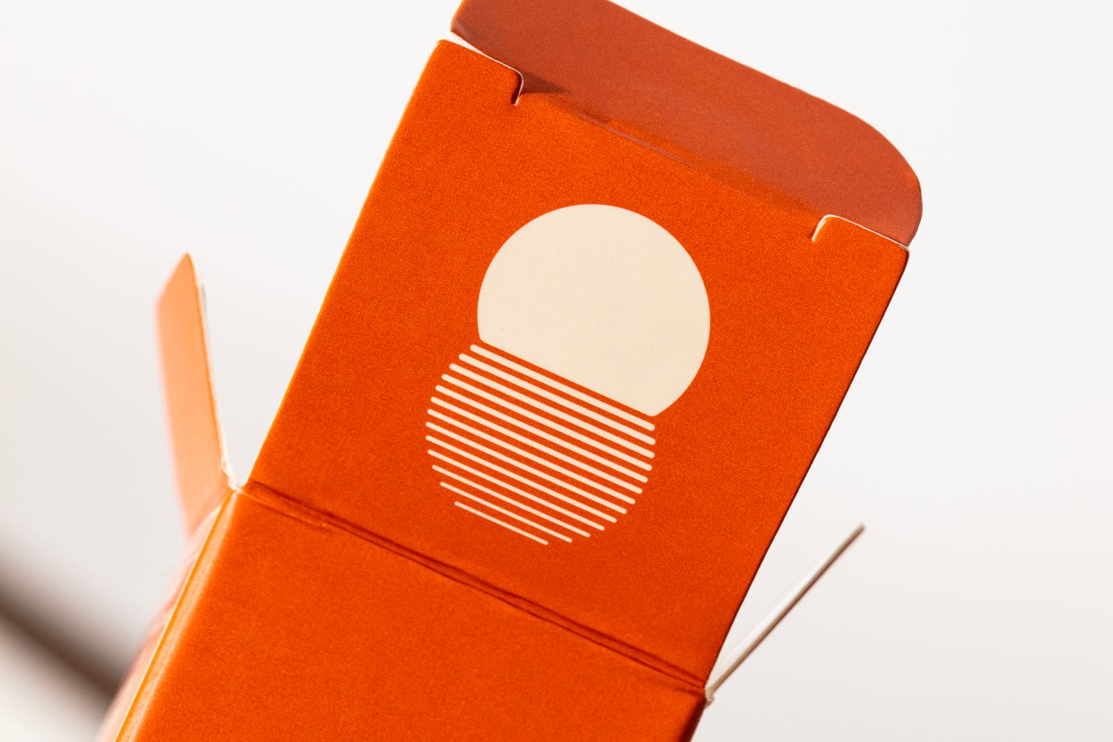 an orange box with a white circle on it