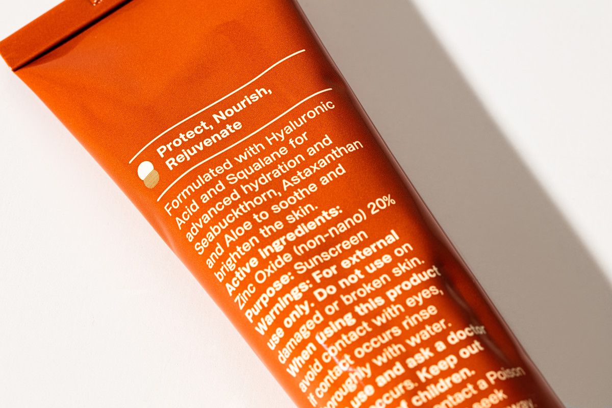 a tube of sunscreen on a white surface