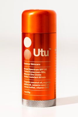 a close up of a can of deodorant on a white surface