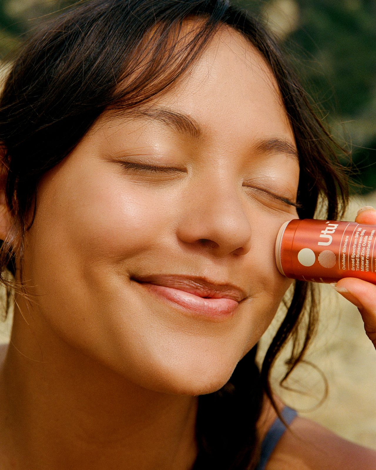 a woman holding a cell phone to her ear