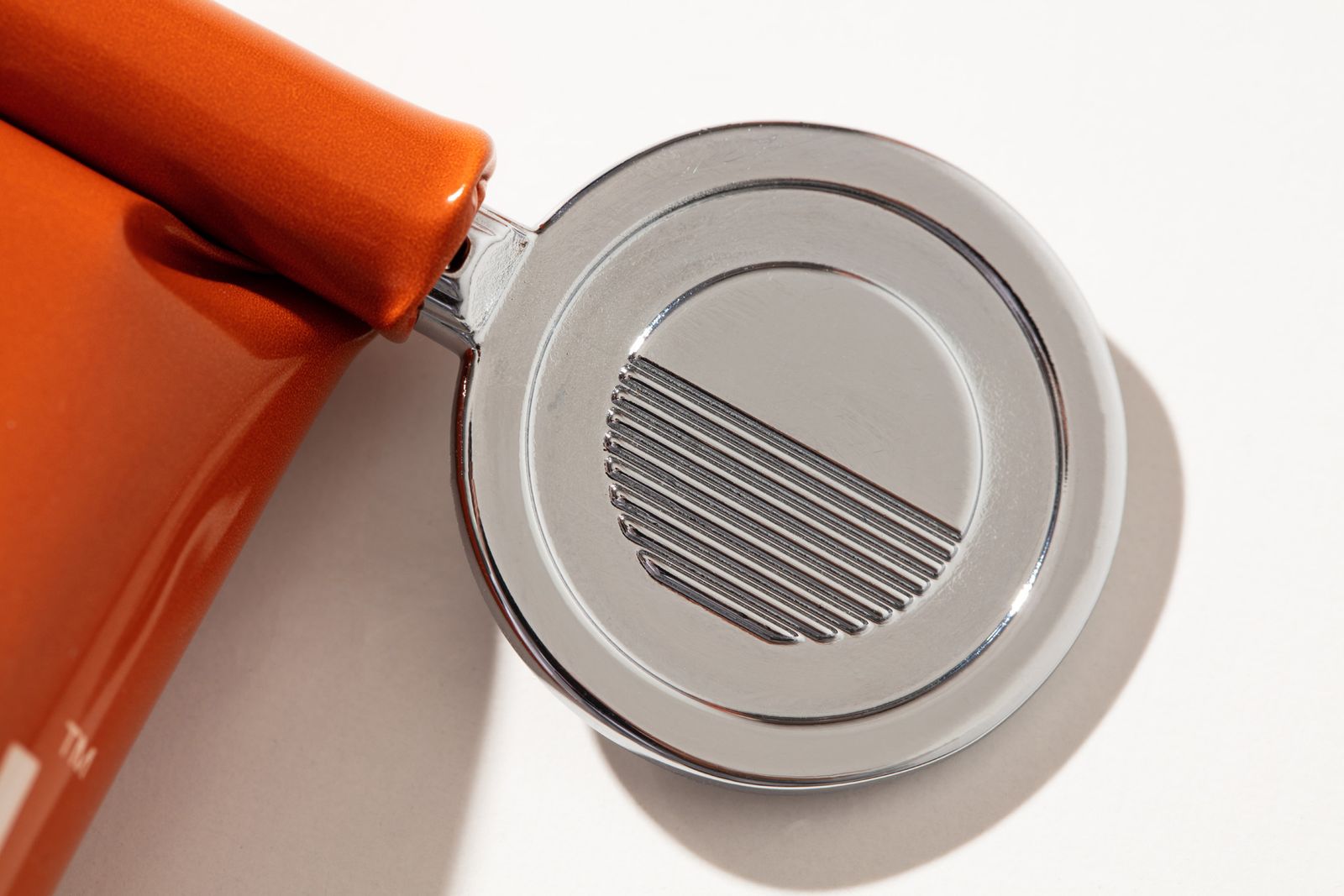 a close up of a speaker on a white surface