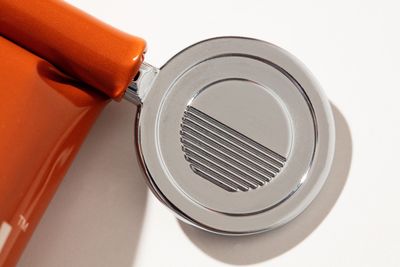 a close up of a speaker on a white surface