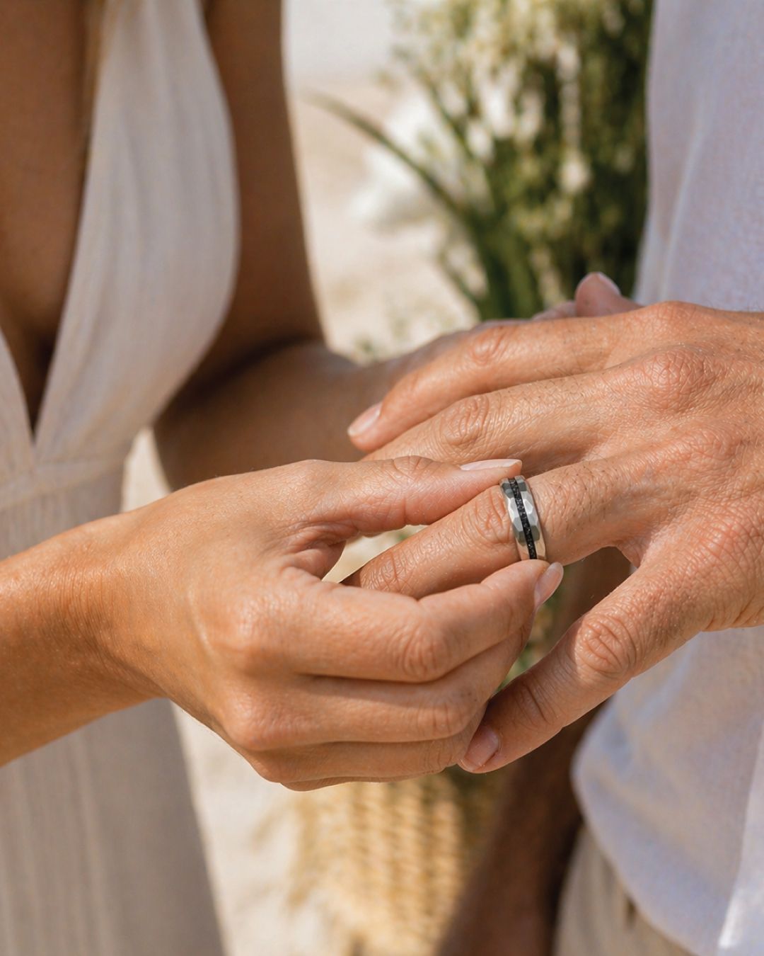 a close up of two people holding hands