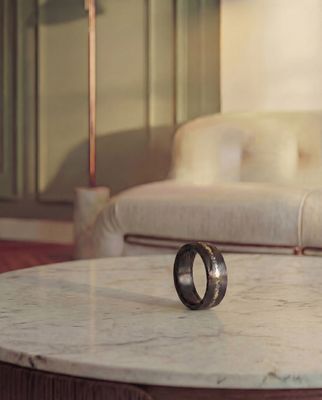 a marble table with a ring on top of it
