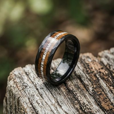 a wedding band with a wood inlay