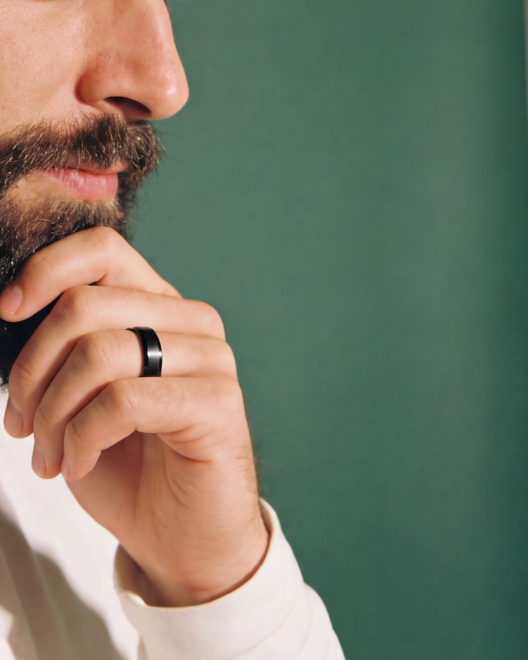 a close up of a person wearing a ring