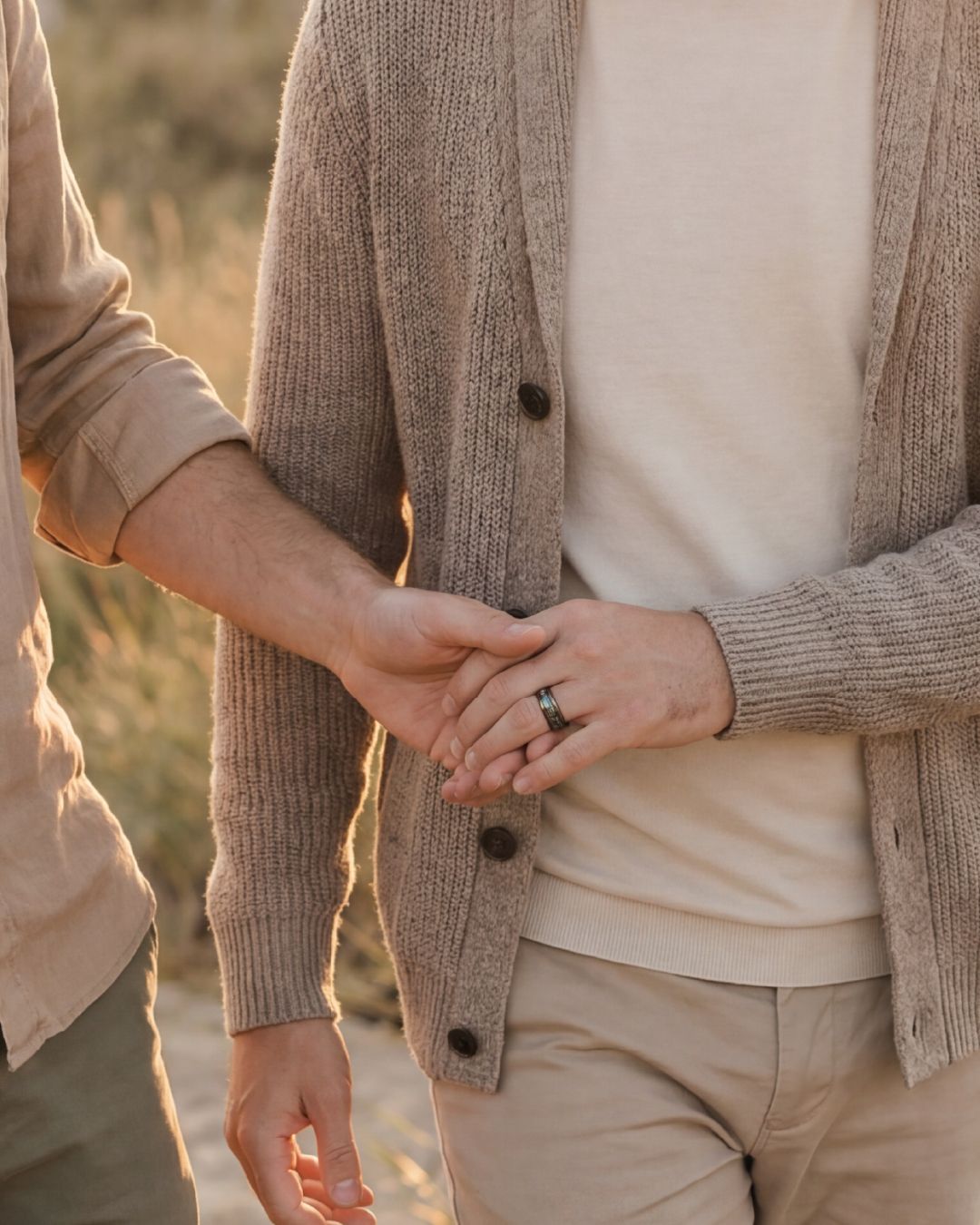a man and a woman holding hands while walking
