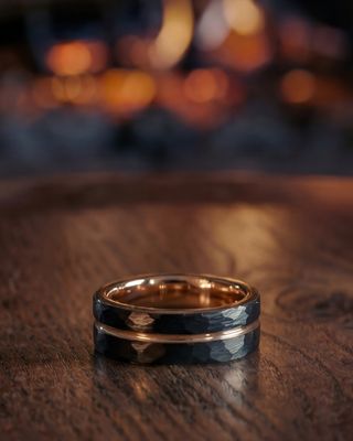 a close up of a wedding ring on a table