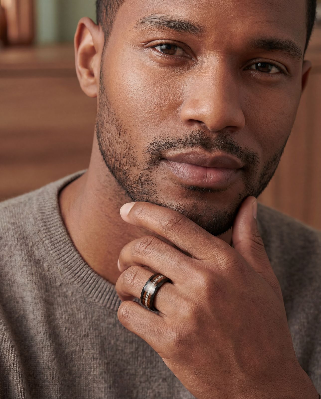 a close up of a person wearing a ring