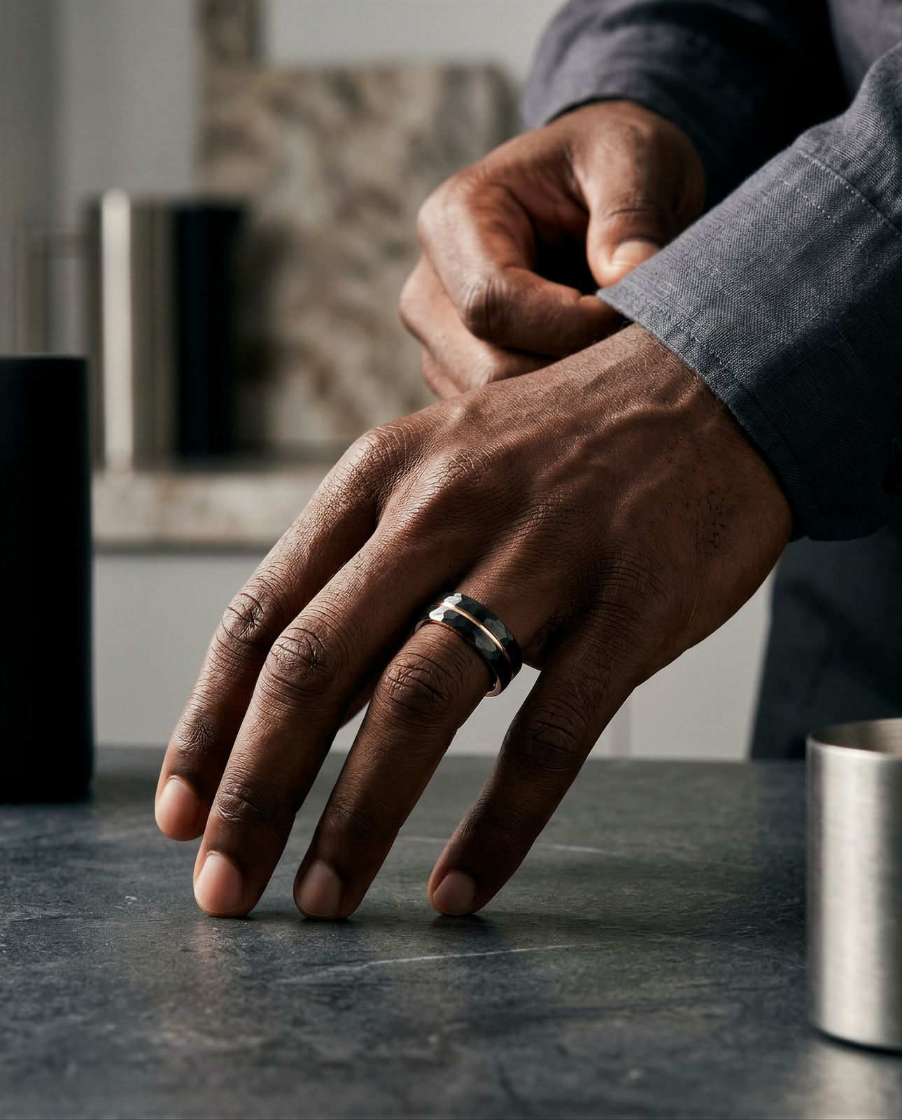 a man in a suit is holding his hand on a table