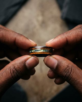 a man holding a ring in his hands