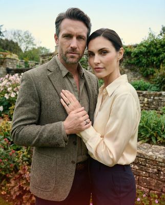 a man and a woman standing next to each other