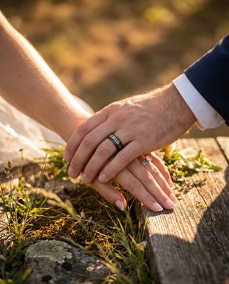 a close up of a person holding the hand of another person