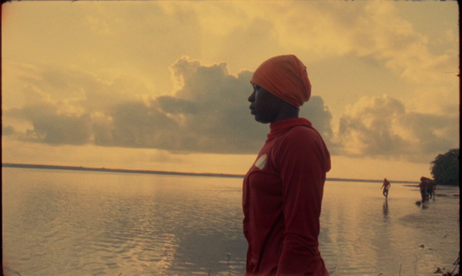 a man in a turban standing in the water